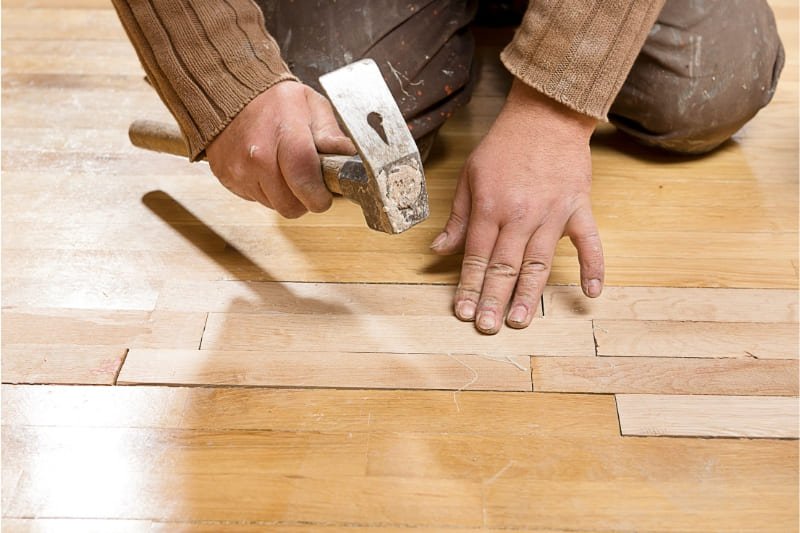 Replacing damaged engineered hardwood flooring. 
